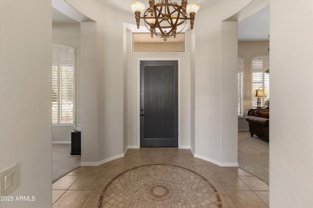 3410 E Inglewood Cir, Mesa, AZ 85213 - tiled foyer featuring baseboards, carpet, and a chandelier
