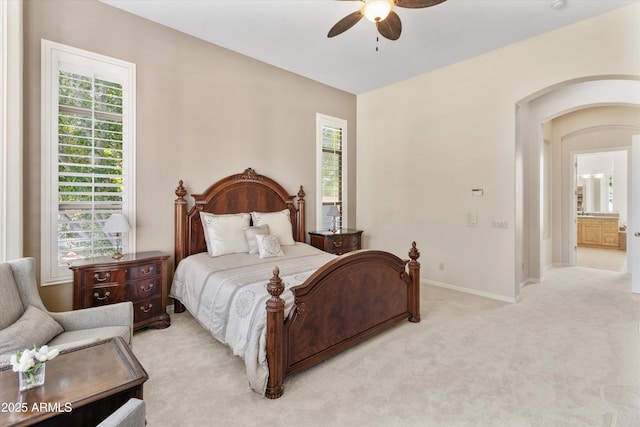 3410 E Inglewood Cir, Mesa, AZ 85213 - bedroom featuring light colored carpet, arched walkways, a ceiling fan, and multiple windows