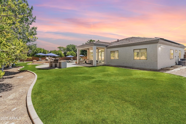 3410 E Inglewood Cir, Mesa, AZ 85213 - rear view of house with a lawn, fence, and a patio area