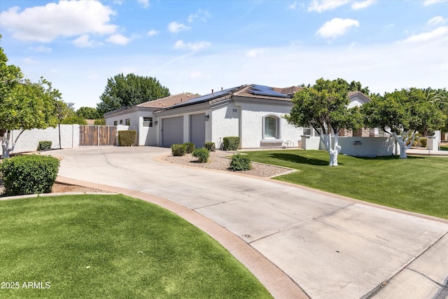 3410 E Inglewood Cir, Mesa, AZ 85213 - single story home with fence, stucco siding, roof mounted solar panels, an attached garage, and driveway