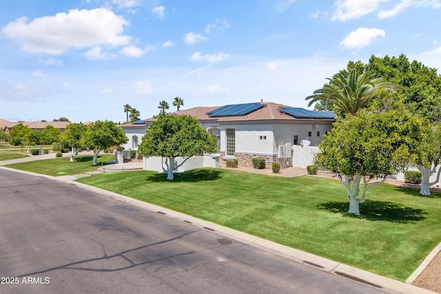 3410 E Inglewood Cir, Mesa, AZ 85213 - ranch-style home with solar panels, a front lawn, stone siding, and stucco siding