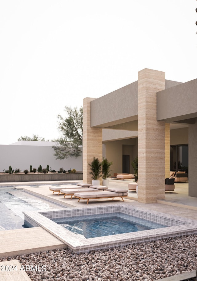 view of swimming pool with a jacuzzi and a patio