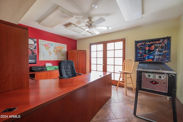 office area with ceiling fan, french doors, and tile patterned flooring