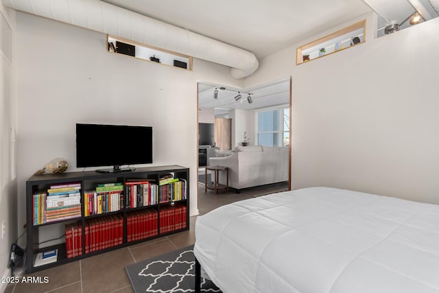 bedroom featuring dark tile patterned floors