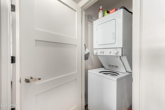 washroom with stacked washer / drying machine