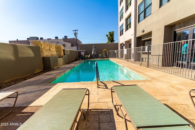 view of swimming pool with a patio