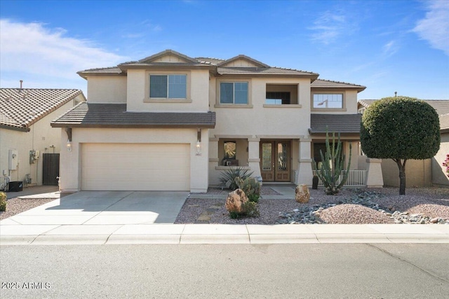 view of front of house featuring a garage and french doors