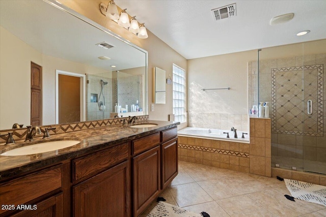 bathroom with vanity, plus walk in shower, and tile patterned flooring