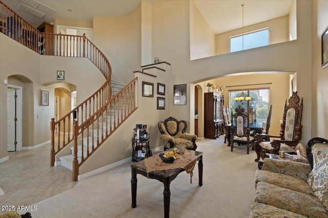 living room featuring an inviting chandelier and light carpet