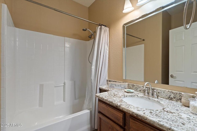 bathroom featuring vanity and shower / bath combination with curtain