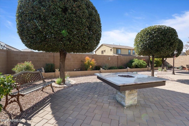 view of patio / terrace with an outdoor fire pit