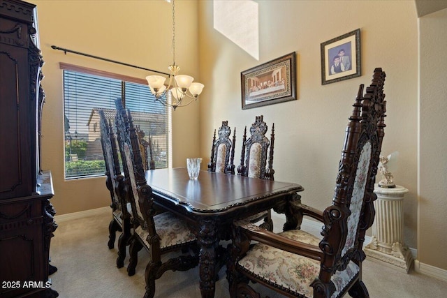 dining space with light carpet and an inviting chandelier