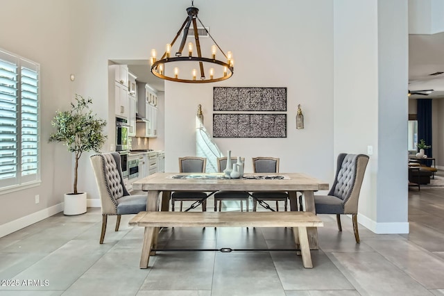 1890 E Sagittarius Pl, Chandler, AZ 85249 - dining space with a chandelier, baseboards, and a towering ceiling
