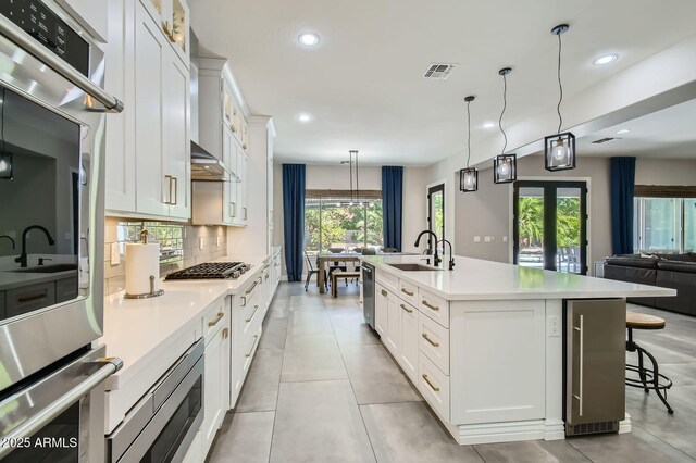1890 E Sagittarius Pl, Chandler, AZ 85249 - kitchen featuring a sink, recessed lighting, stainless steel appliances, open floor plan, and light countertops