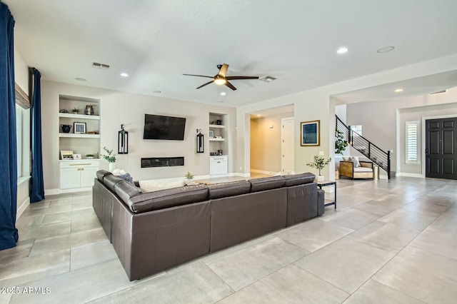 1890 E Sagittarius Pl, Chandler, AZ 85249 - living room featuring built in features, stairs, ceiling fan, recessed lighting, and light tile patterned floors