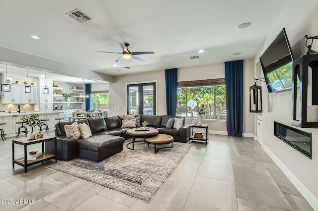 1890 E Sagittarius Pl, Chandler, AZ 85249 - living area featuring healthy amount of natural light, ceiling fan, baseboards, and recessed lighting