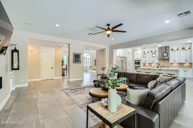 1890 E Sagittarius Pl, Chandler, AZ 85249 - living room featuring ceiling fan, recessed lighting, baseboards, and light tile patterned flooring