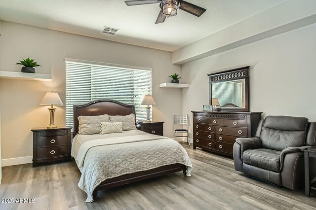 1890 E Sagittarius Pl, Chandler, AZ 85249 - bedroom featuring multiple windows, wood finished floors, ceiling fan, and baseboards