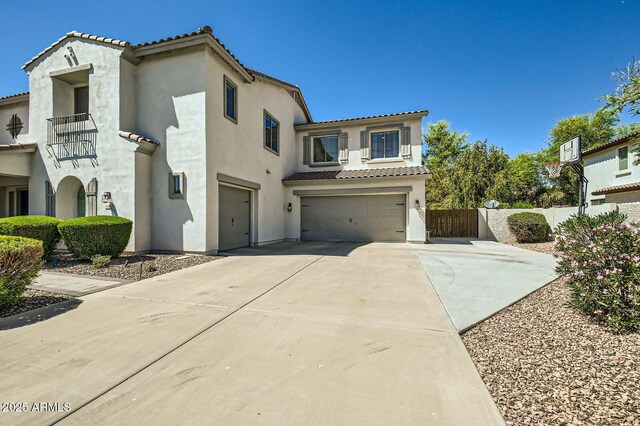 1890 E Sagittarius Pl, Chandler, AZ 85249 - mediterranean / spanish-style house with a garage, a tiled roof, concrete driveway, stucco siding, and fence