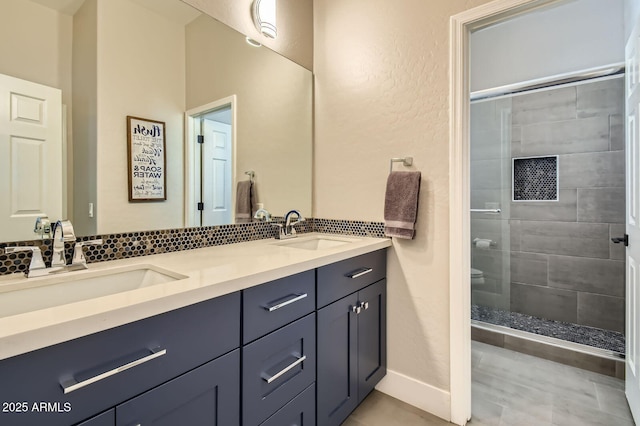 1890 E Sagittarius Pl, Chandler, AZ 85249 - full bath featuring a shower stall, double vanity, decorative backsplash, and tile patterned floors