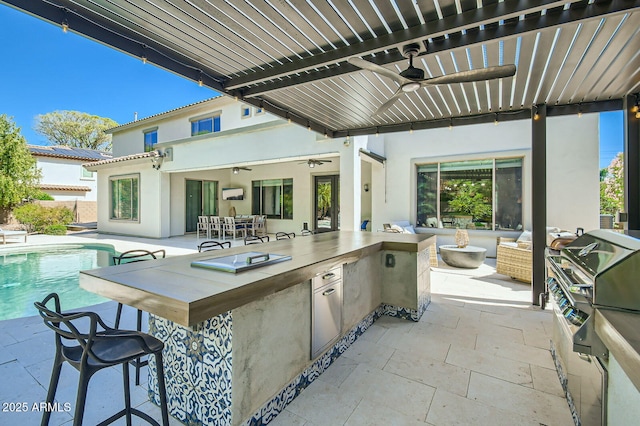 1890 E Sagittarius Pl, Chandler, AZ 85249 - view of patio / terrace featuring ceiling fan, an outdoor kitchen, an outdoor pool, and area for grilling