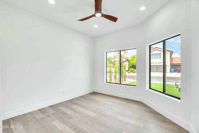 unfurnished room with ceiling fan and light hardwood / wood-style flooring