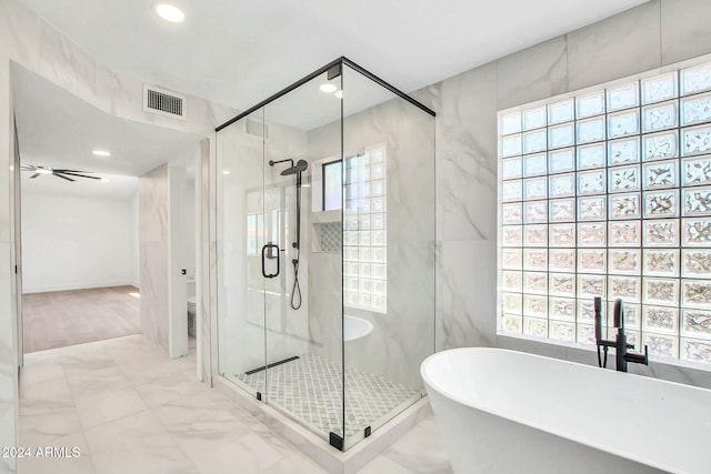 bathroom with separate shower and tub, ceiling fan, a healthy amount of sunlight, and toilet