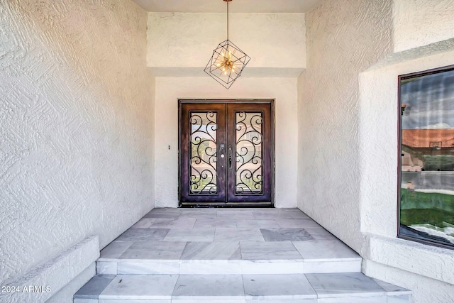 doorway to property featuring french doors