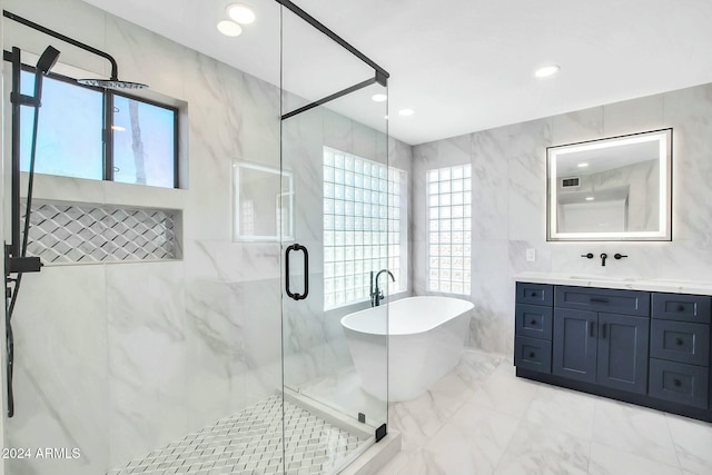 bathroom featuring a wealth of natural light, tile walls, and shower with separate bathtub