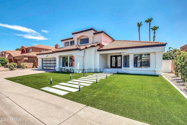 mediterranean / spanish-style home with a front yard