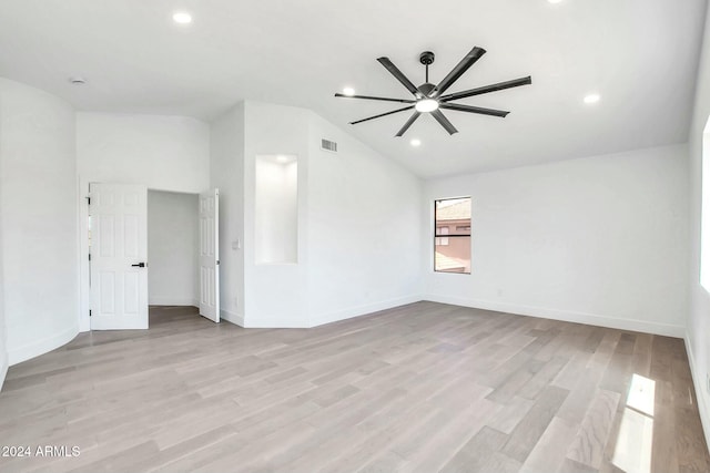 unfurnished room with ceiling fan, light hardwood / wood-style flooring, and vaulted ceiling