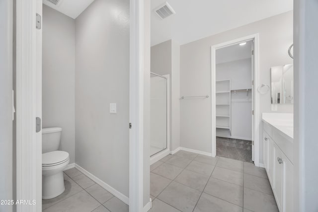 8944 N 180th Dr, Waddell, AZ 85355 - bathroom with a shower stall, tile patterned flooring, visible vents, and toilet