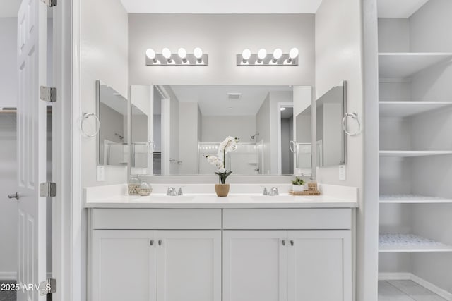 8944 N 180th Dr, Waddell, AZ 85355 - bathroom with double vanity, visible vents, a closet, and a sink
