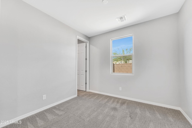 8944 N 180th Dr, Waddell, AZ 85355 - unfurnished room featuring visible vents, baseboards, and carpet