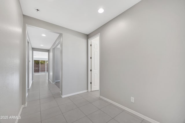 8944 N 180th Dr, Waddell, AZ 85355 - hall featuring light tile patterned floors, baseboards, and recessed lighting