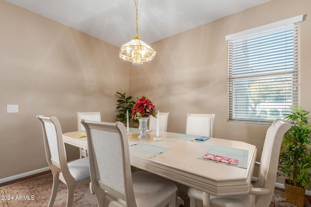 dining room featuring a notable chandelier