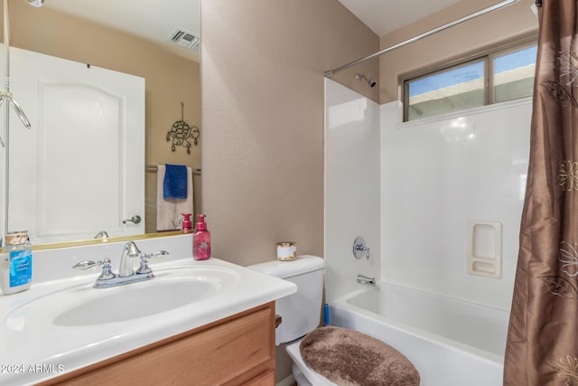 full bathroom featuring shower / bath combo, vanity, and toilet