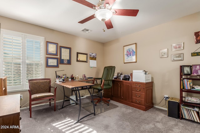 carpeted office with ceiling fan