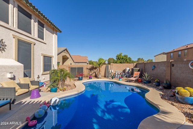 view of swimming pool featuring a patio