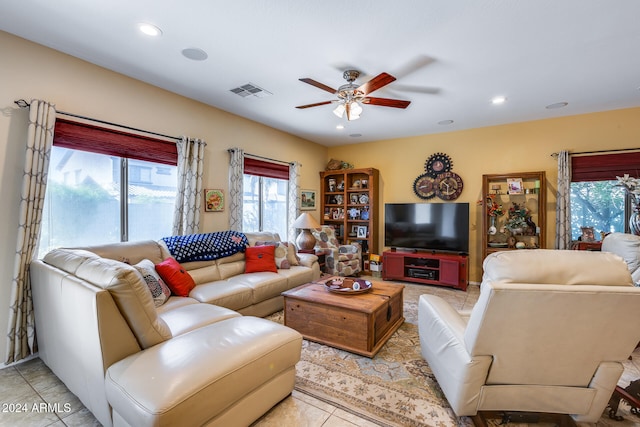 living room with light tile patterned flooring and ceiling fan