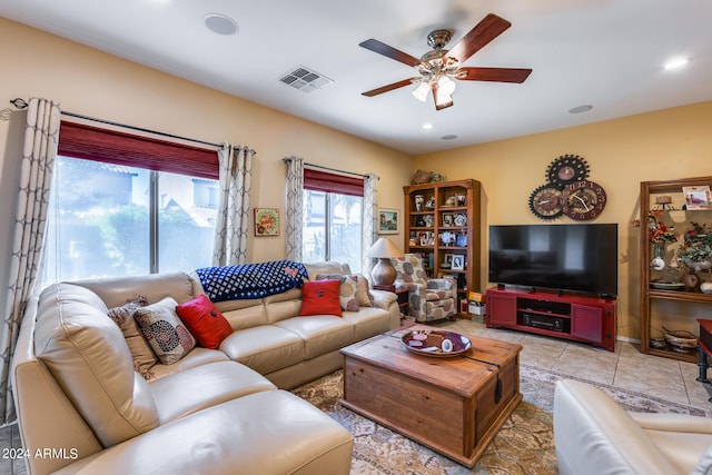 tiled living room with ceiling fan