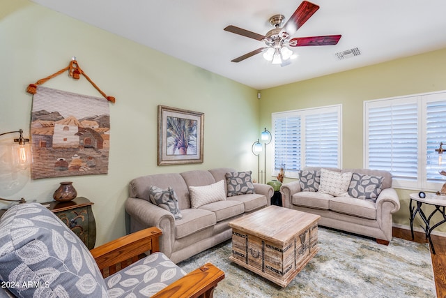 living room with hardwood / wood-style flooring and ceiling fan