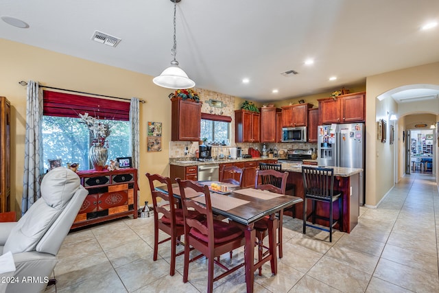 dining area with light tile patterned flooring