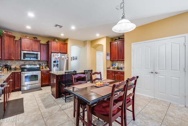 dining room featuring light tile patterned floors