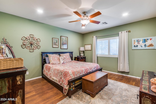 bedroom with ceiling fan and hardwood / wood-style floors