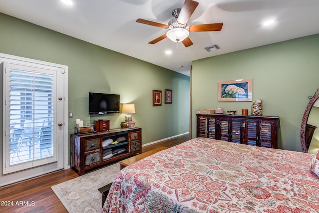 bedroom featuring access to exterior, dark hardwood / wood-style flooring, and ceiling fan