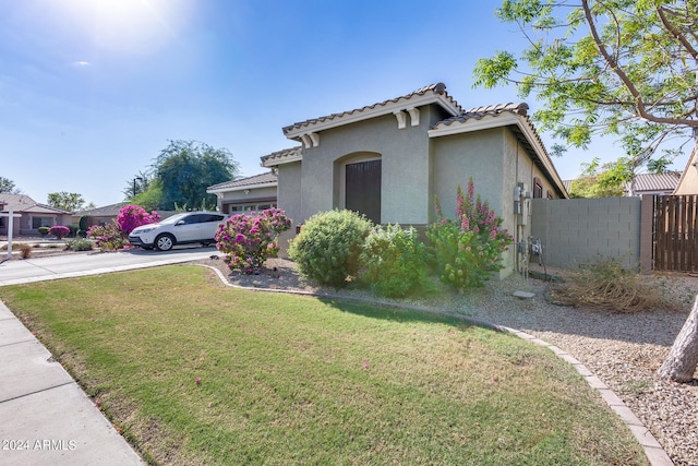 view of home's exterior with a yard