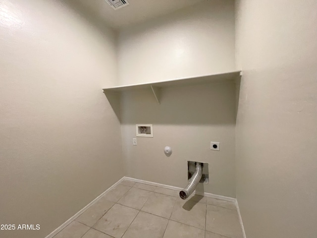 washroom with hookup for an electric dryer, light tile patterned floors, hookup for a washing machine, laundry area, and hookup for a gas dryer