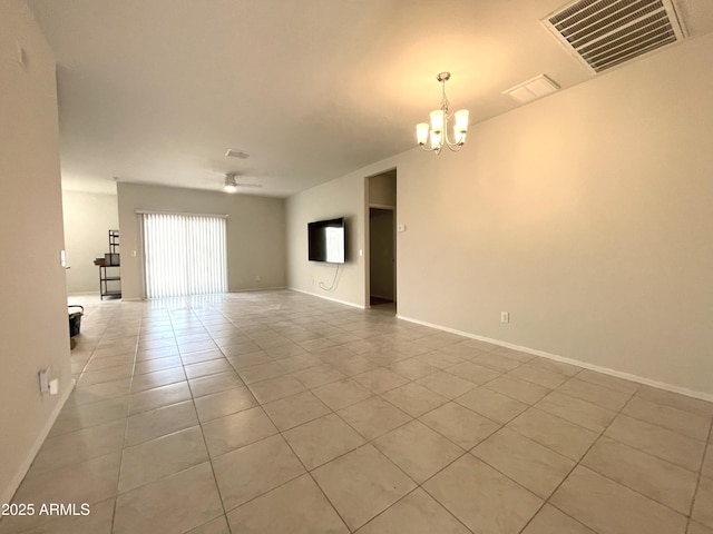 interior space with baseboards, visible vents, a notable chandelier, and light tile patterned floors