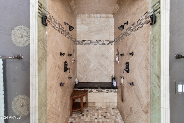 bathroom featuring a tile shower and tile patterned floors